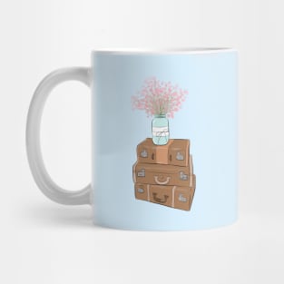 Pile of baggage with a jar with flowers Mug